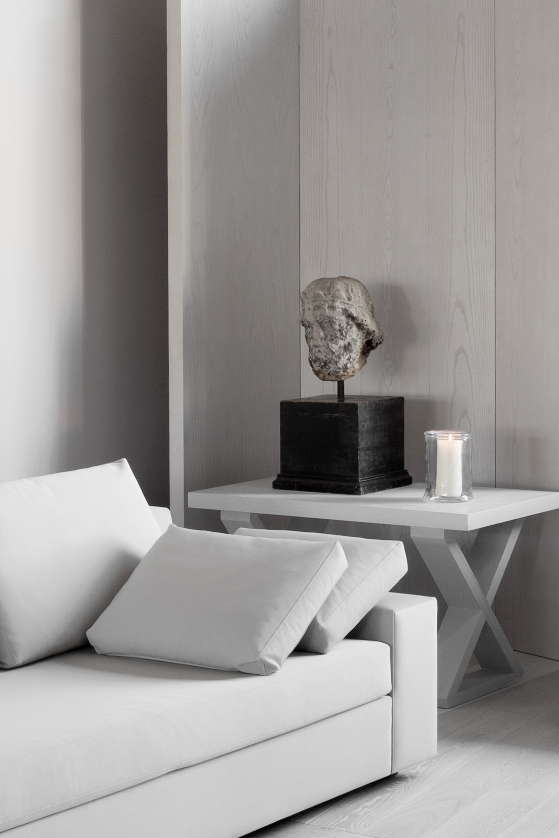 Kennedy Residence by Guillaume Alan — linen bench and console, head sculpture on a black plinth, residence in Paris