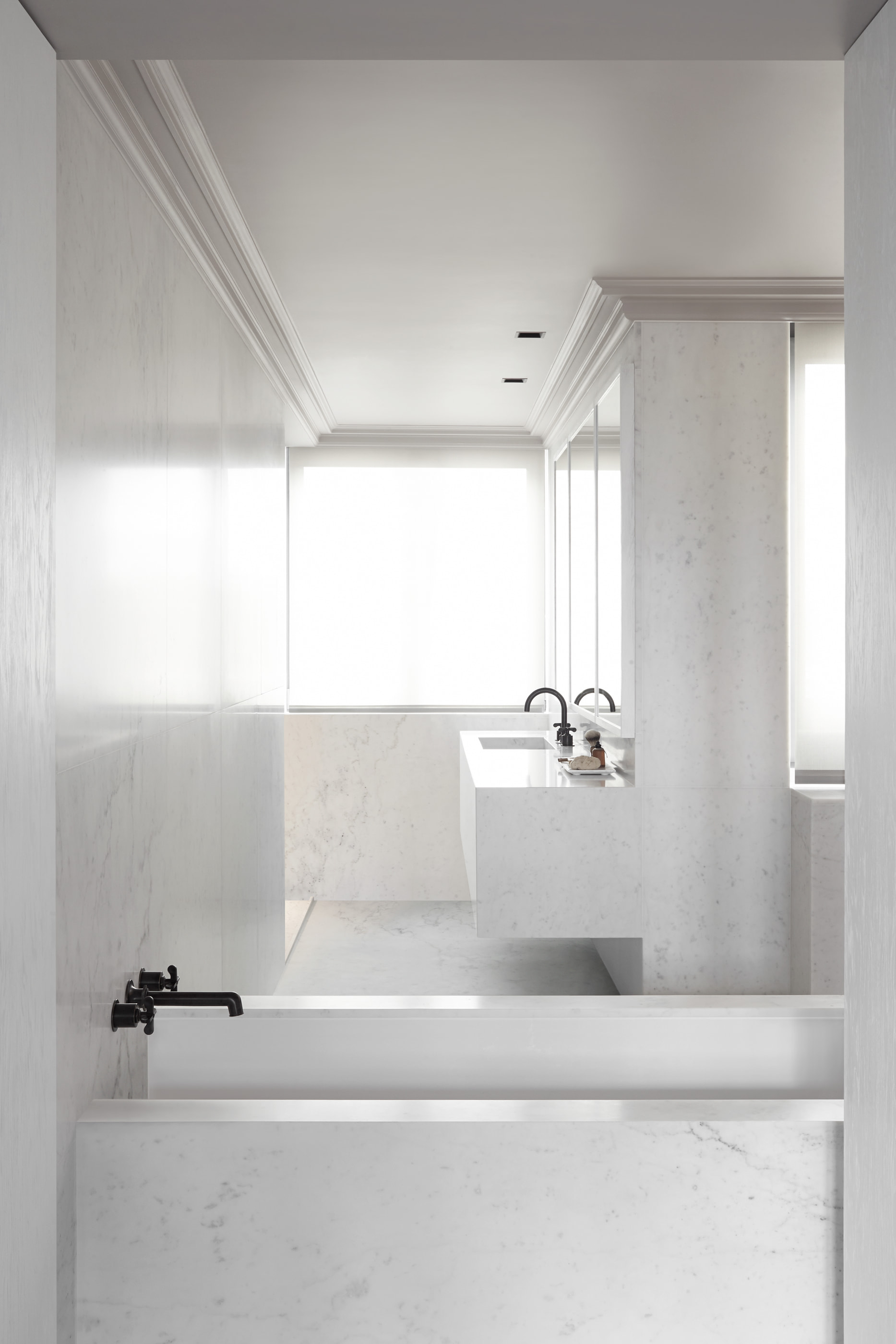 Kennedy Residence by Guillaume Alan — marble bathroom, bathtub beneath the window, residence in Paris
