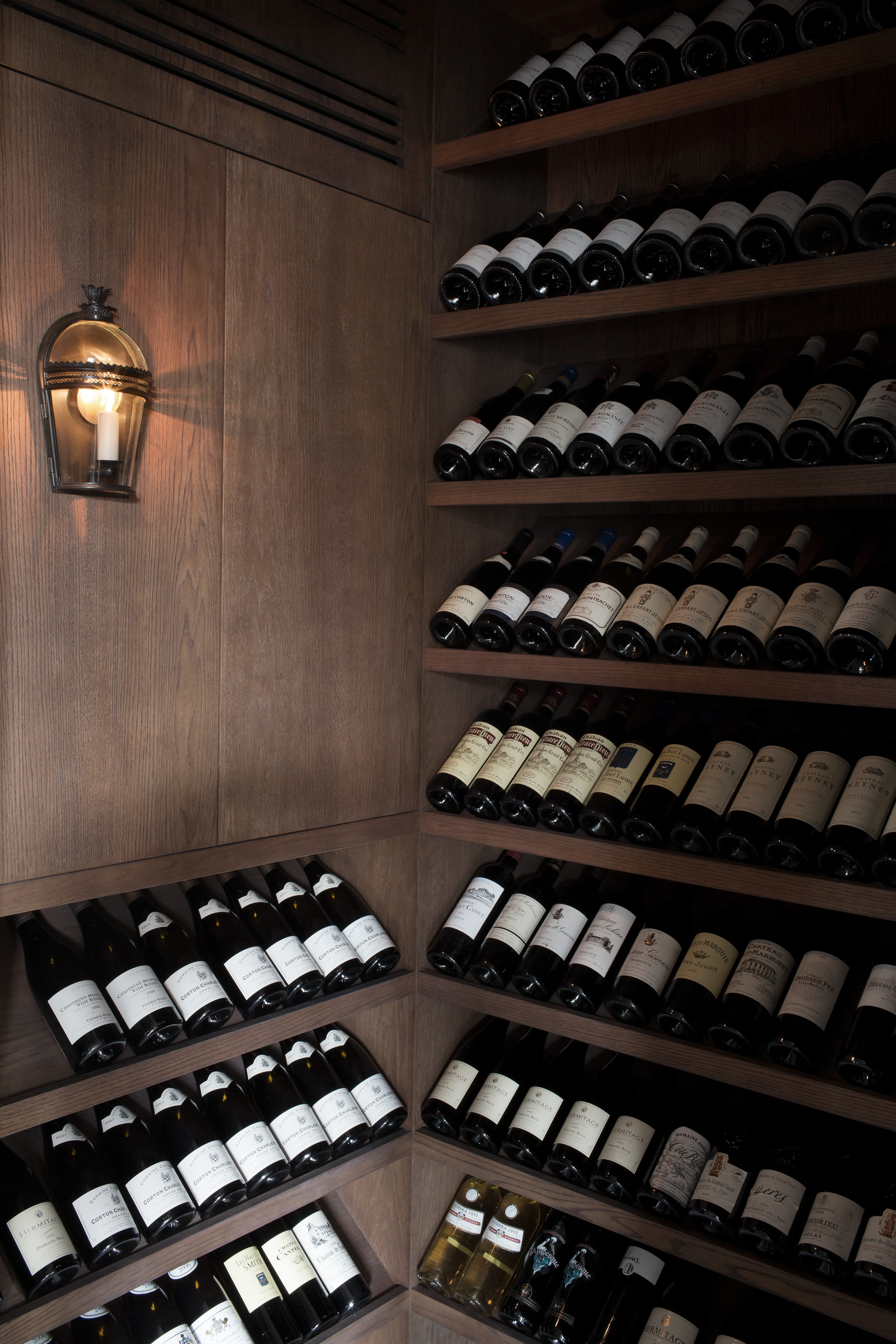 Kennedy Residence by Guillaume Alan — wine cellar, wooden racks and lantern, residence in Paris