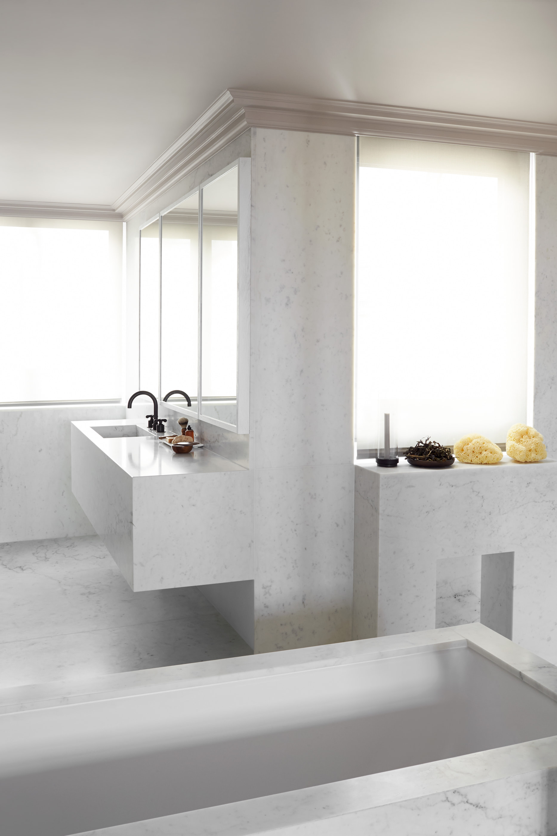 Kennedy Residence by Guillaume Alan — marble bathroom, washbasin counter in front of the window, residence in Paris