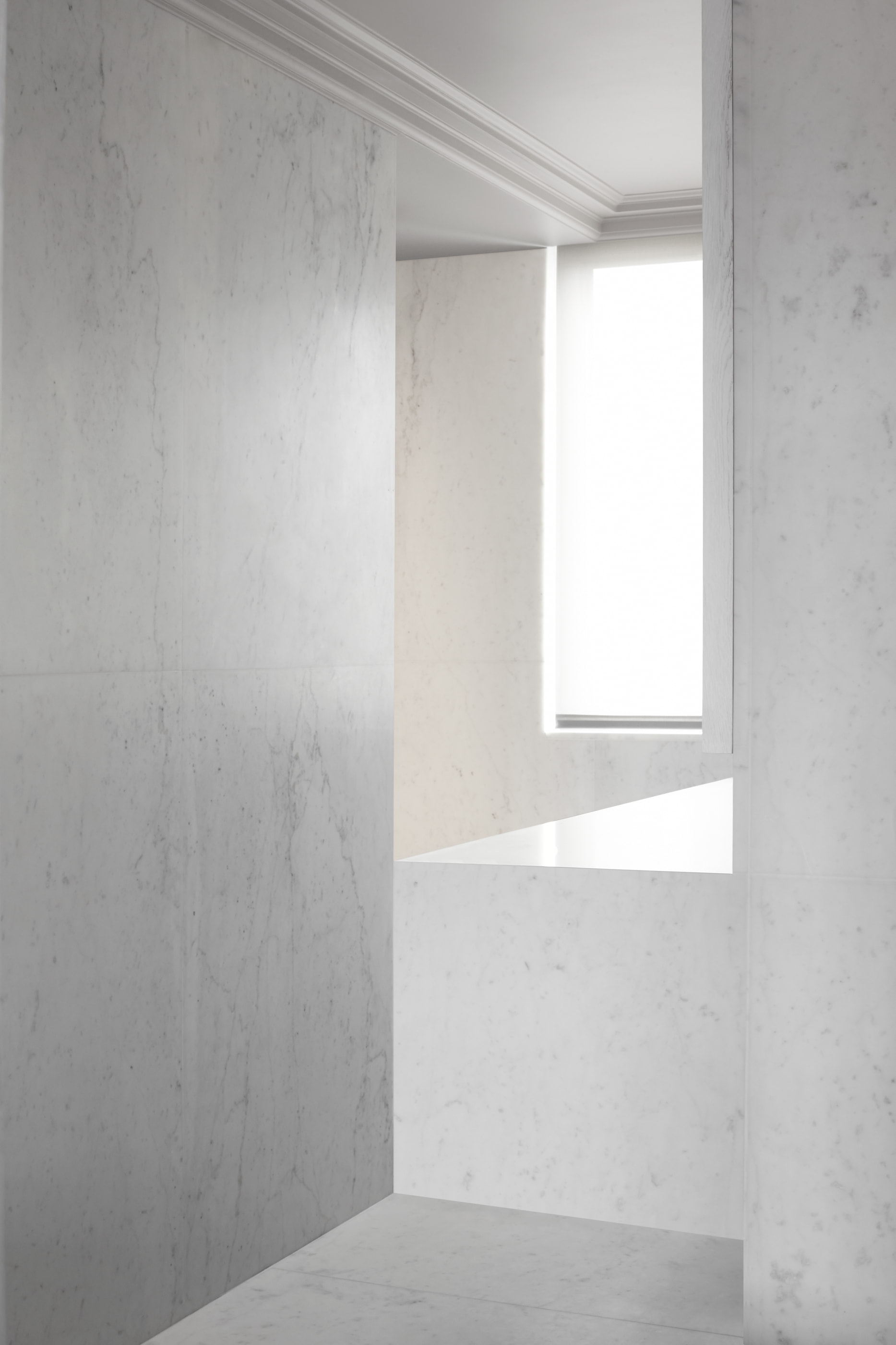 Kennedy Residence by Guillaume Alan — marble wall corner and narrow window, residence in Paris