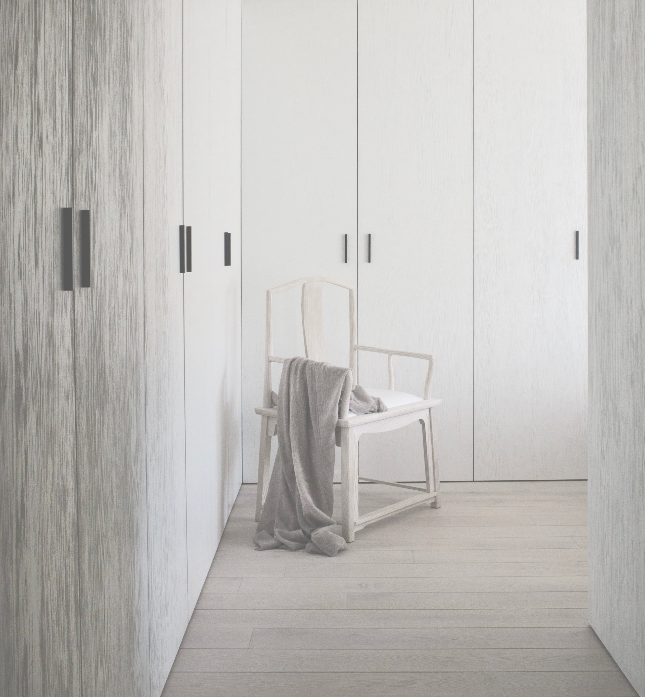Kennedy Residence by Guillaume Alan — dressing room, full-height wardrobe and armchair with throw, residence in Paris