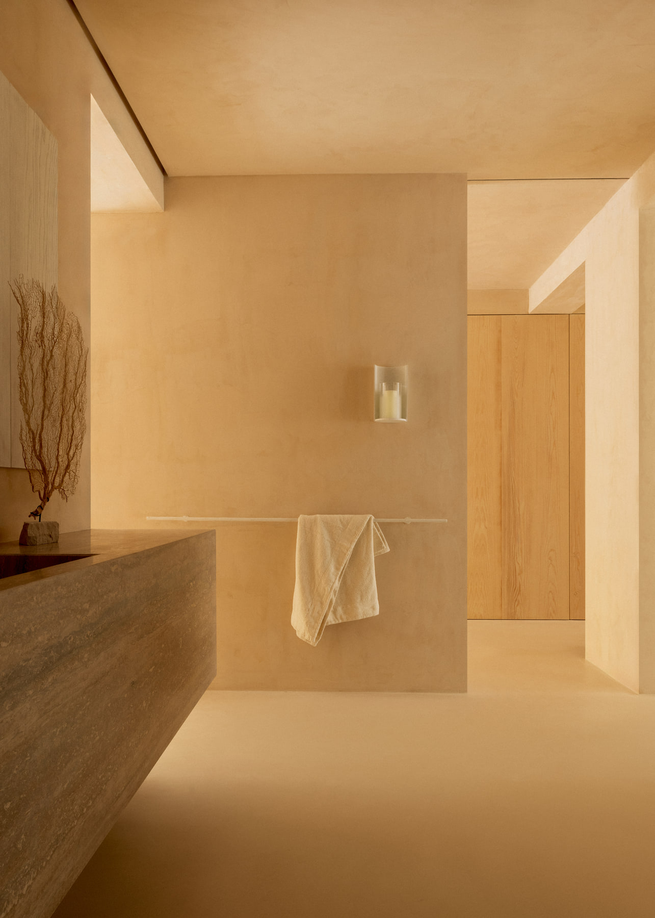 L’Imparfait by Guillaume Alan — bathroom with stone basin and linen towel, apartment in Paris