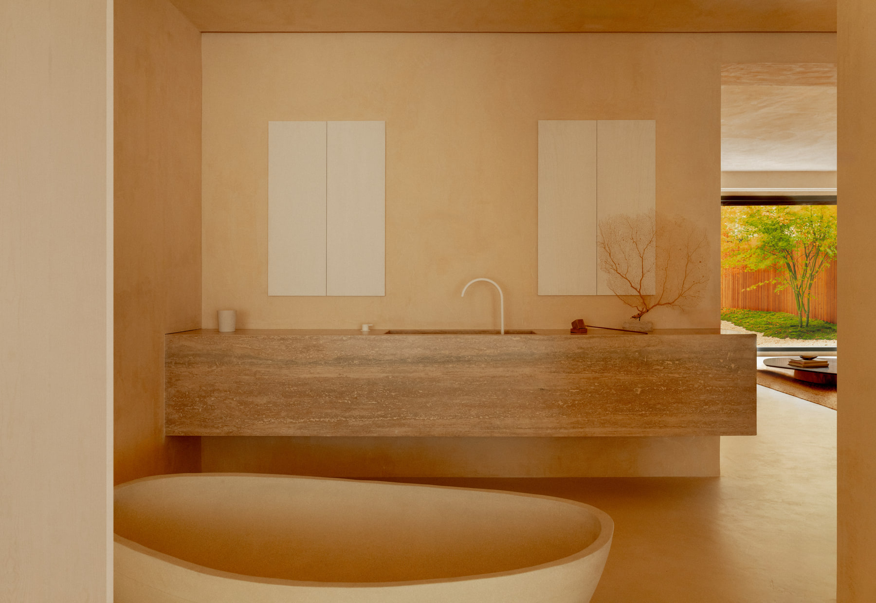 L’Imparfait by Guillaume Alan — stone bath and travertine vanity, apartment in Paris