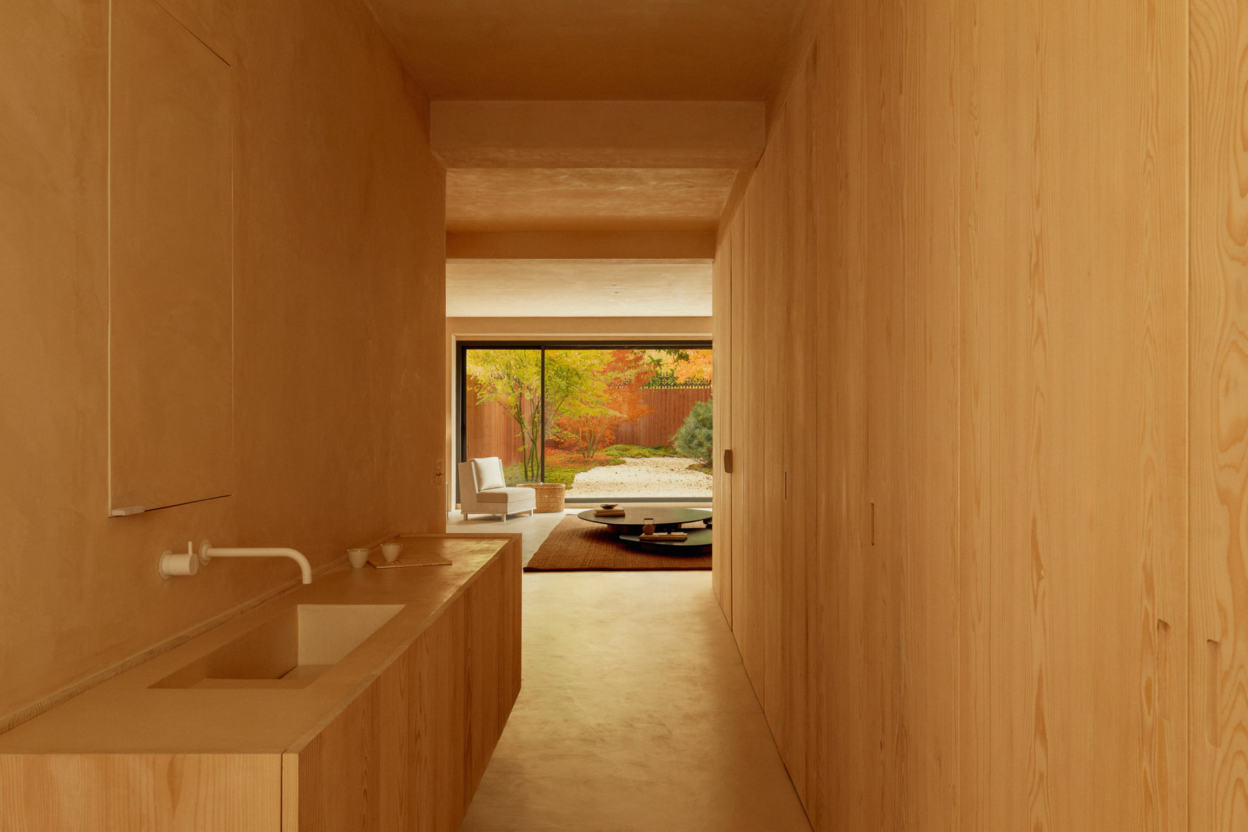L’Imparfait by Guillaume Alan — enfilade of plaster rooms towards the garden, apartment in Paris