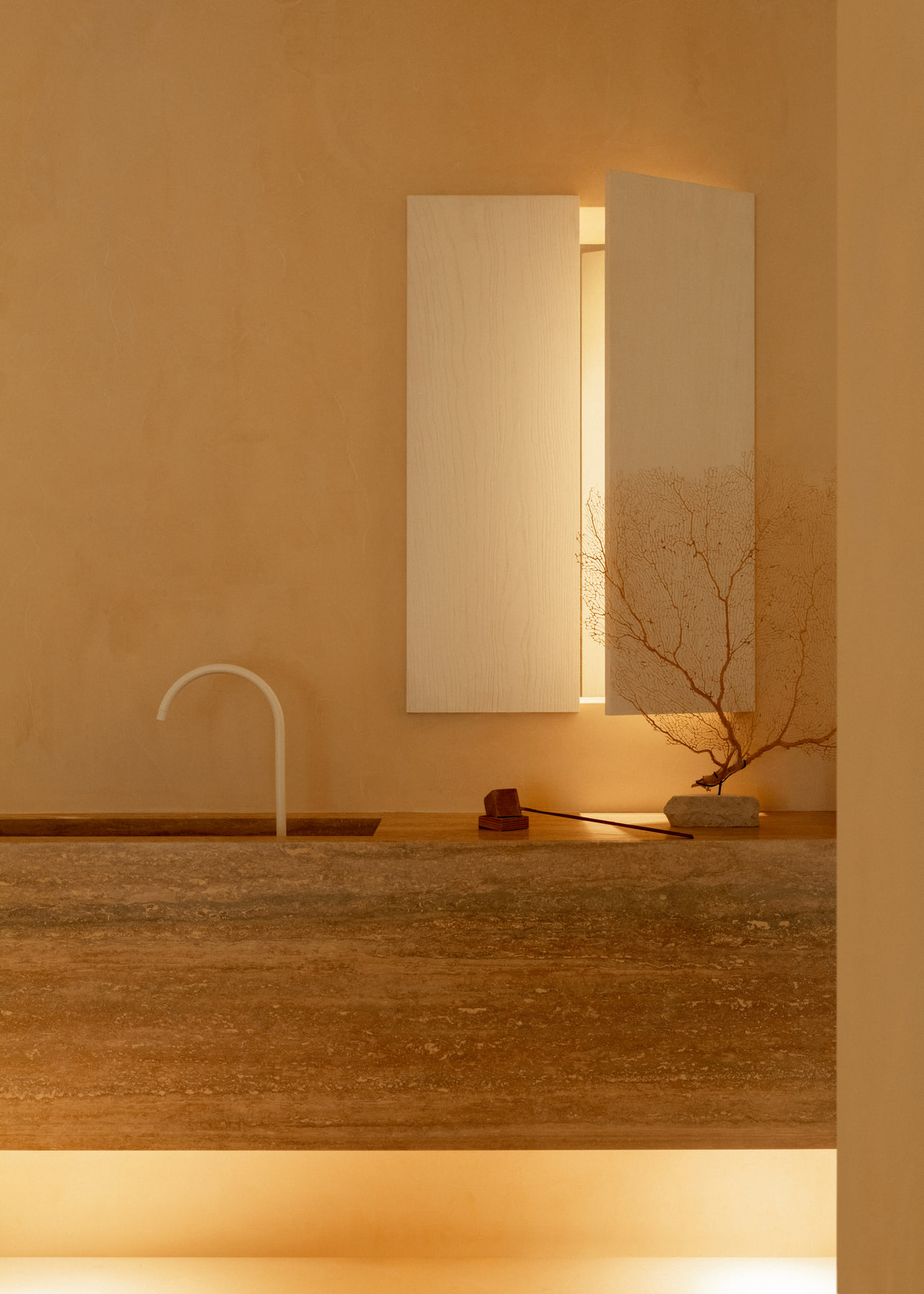 L’Imparfait by Guillaume Alan — stone basin and coral branch, apartment in Paris