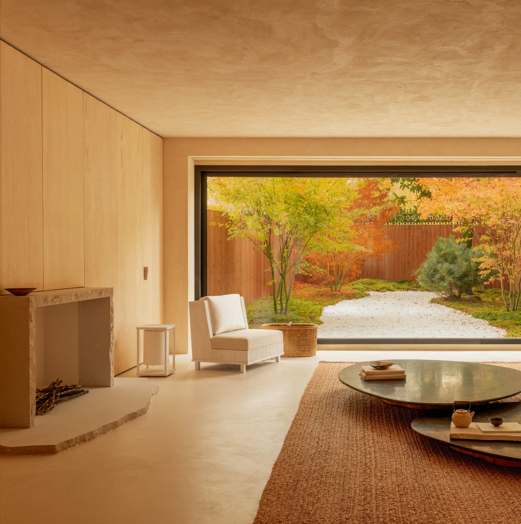 L’Imparfait by Guillaume Alan — living room facing the garden, rug and round table, apartment in Paris