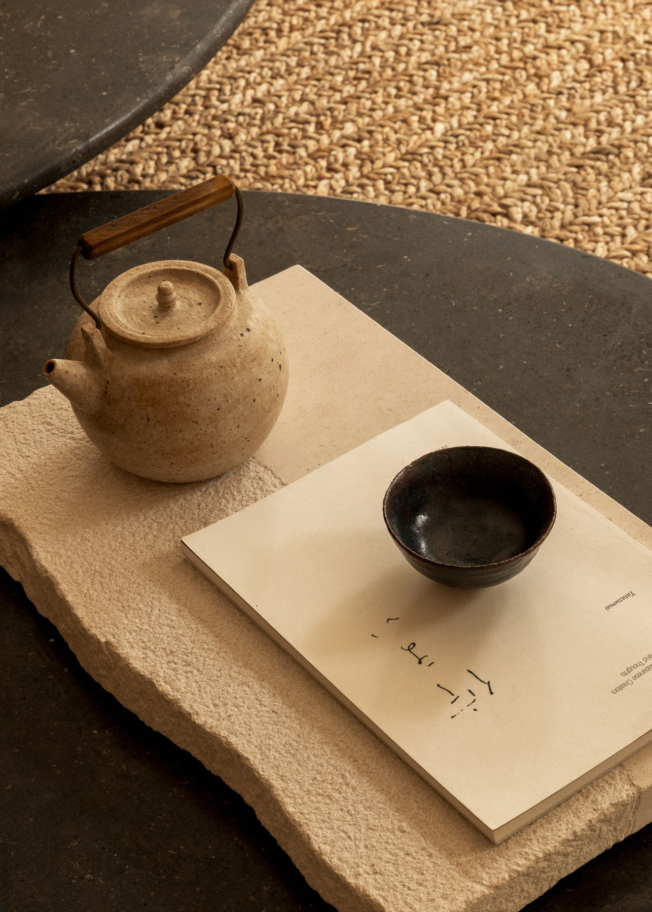 L’Imparfait by Guillaume Alan — teapot and black bowl on a stone tray, apartment in Paris