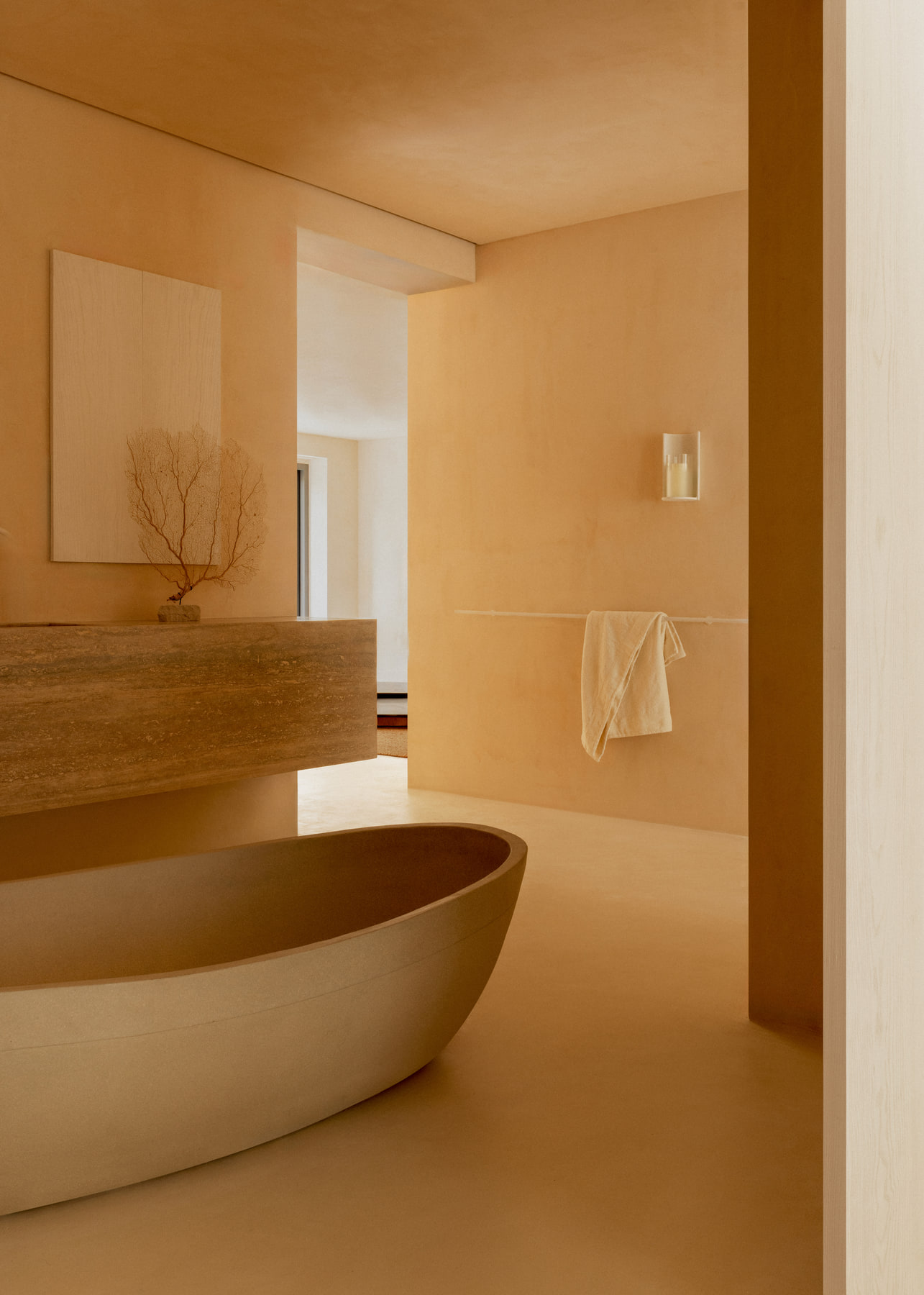 L’Imparfait by Guillaume Alan — stone bath and travertine vanity, apartment in Paris