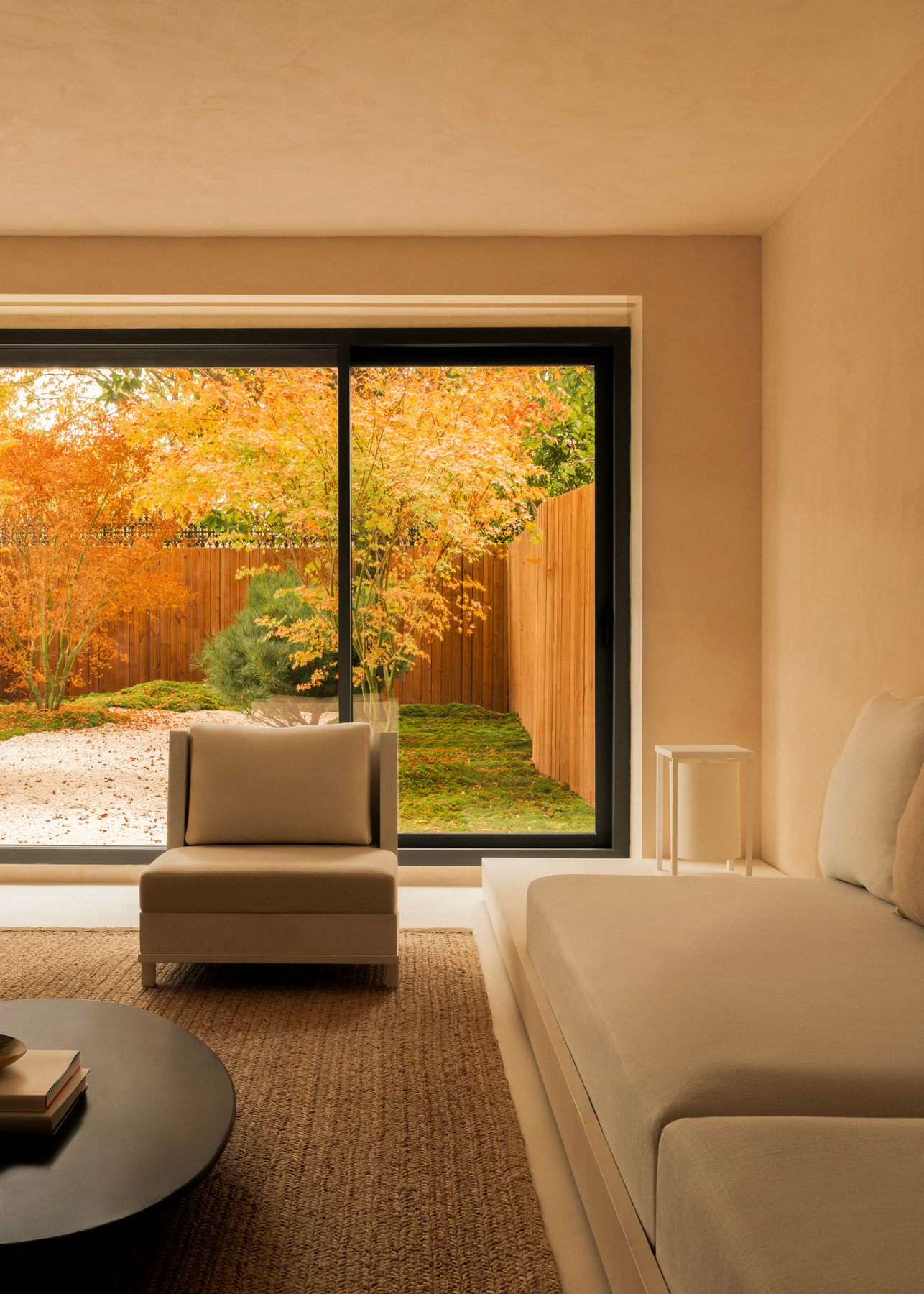 L’Imparfait by Guillaume Alan — living room with sofa and garden view, apartment in Paris