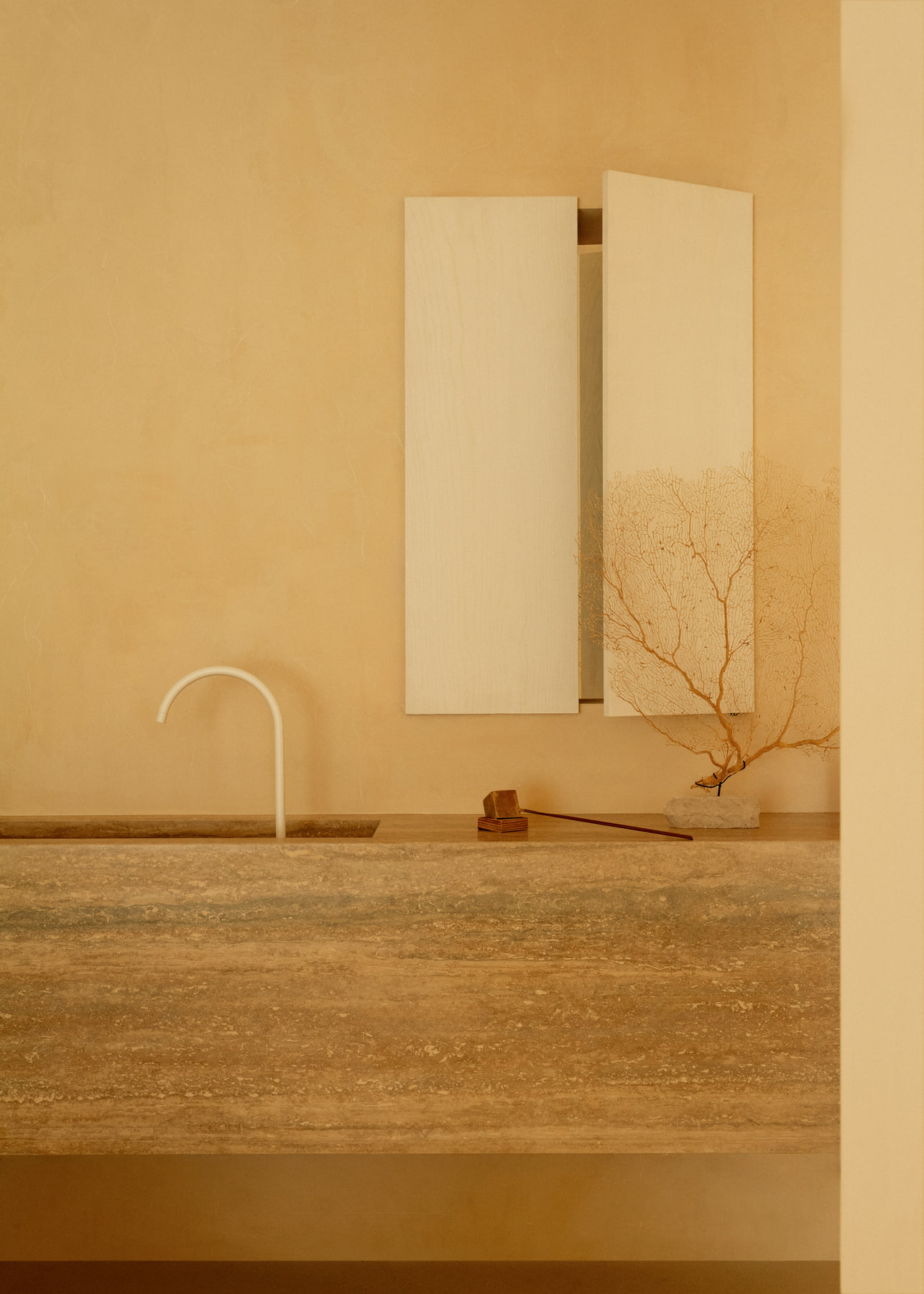 L’Imparfait by Guillaume Alan — stone basin and slender spout, apartment in Paris