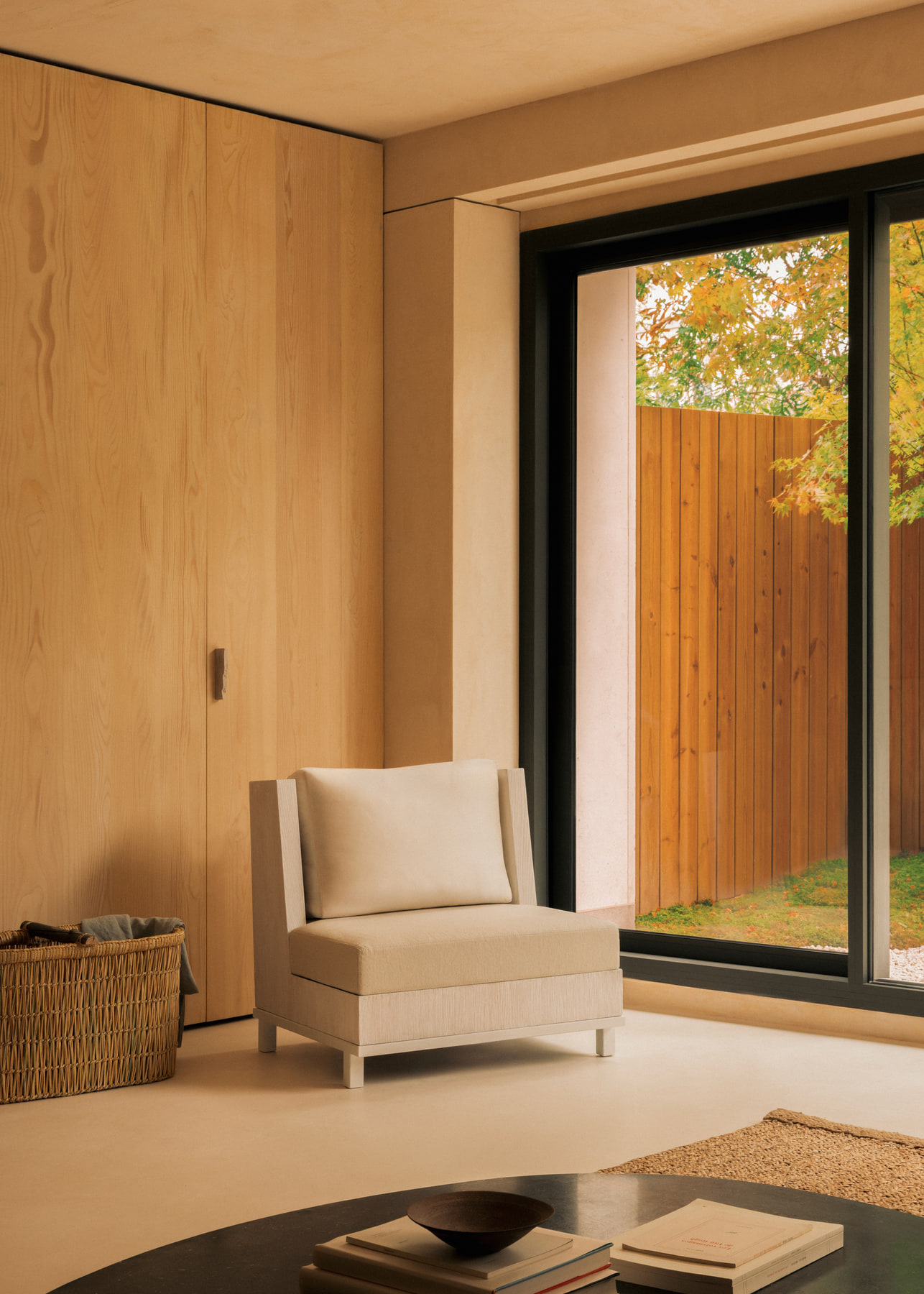 L’Imparfait by Guillaume Alan — armchair by the window, apartment in Paris