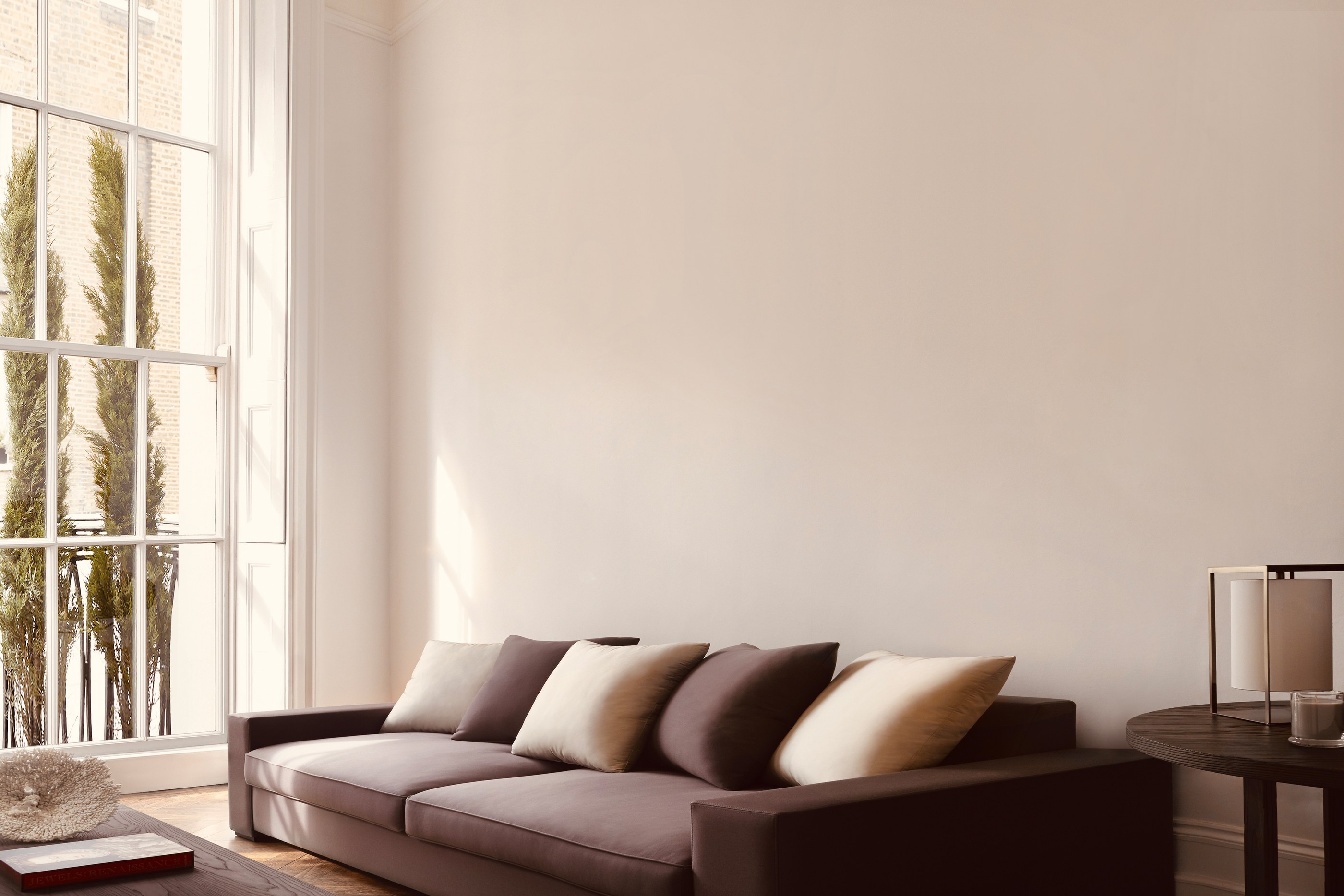 Mayfair House by Guillaume Alan — drawing room, deep sofa beneath a tall Georgian window, residence in London