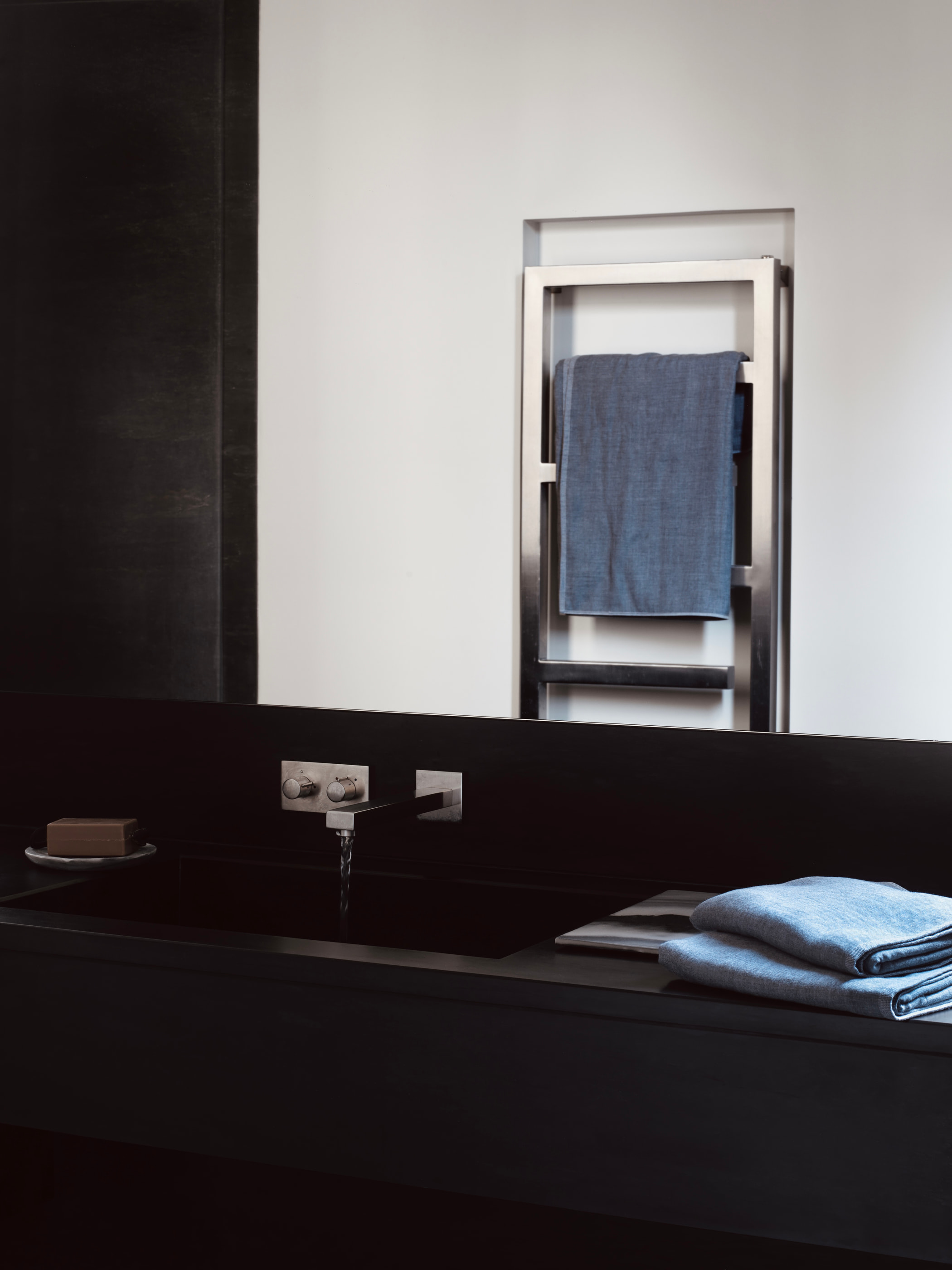 VH Penthouse by Guillaume Alan — black marble bathroom, basin and towel warmer, apartment in Paris