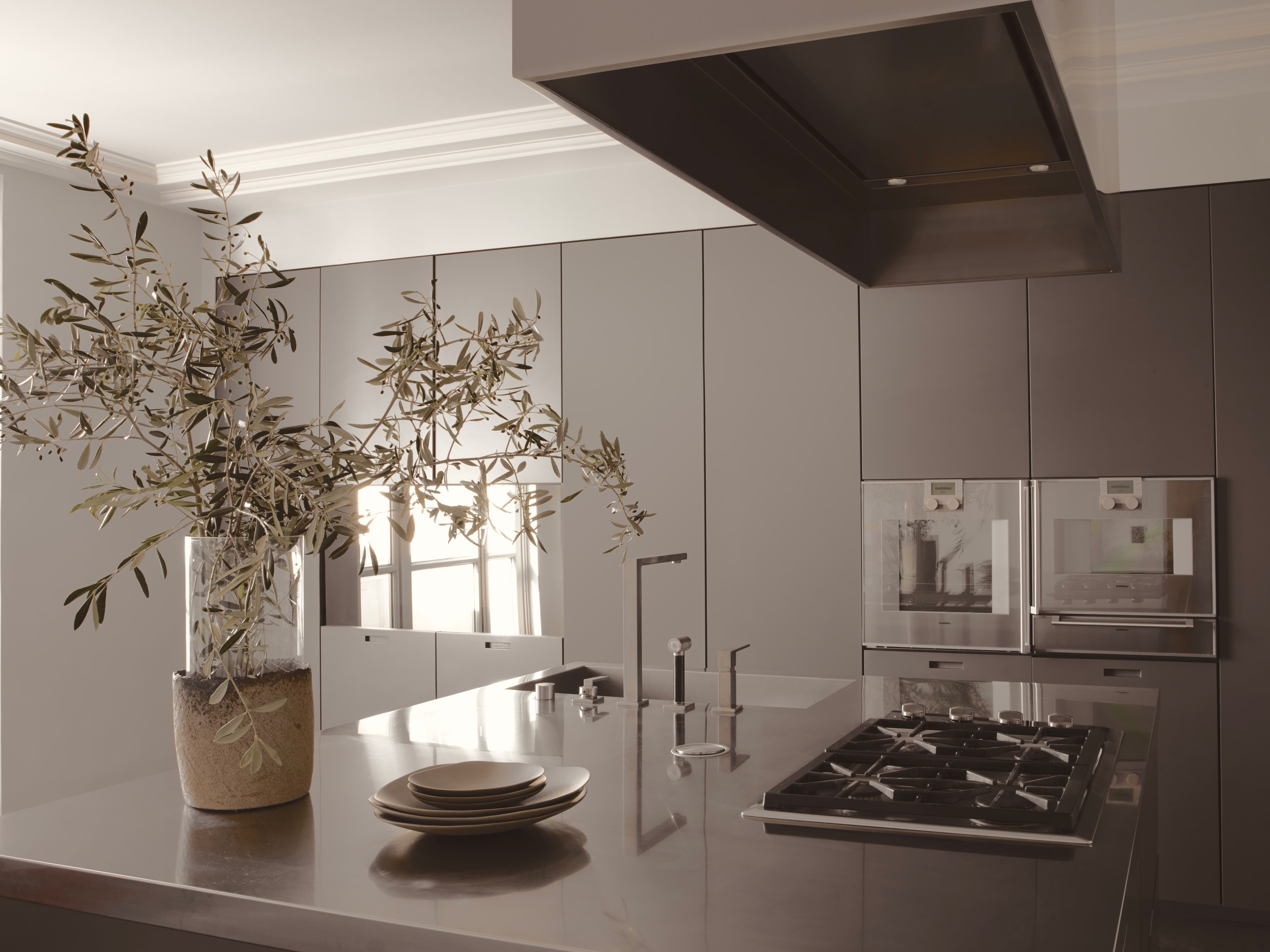 VH Penthouse by Guillaume Alan — kitchen, worktop and olive branches, apartment in Paris